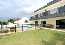 Foto Sobrado com 3 dormitórios à venda, 318 m² por R$ 1.200.000,00 - Condomínio Portal do Sol - Tremembé/SP