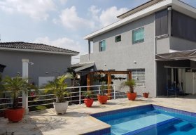 Foto Sobrado com 4 dormitórios à venda, 459 m² por R$ 1.500.000,00 - Piracangaguá (Chácara Flórida) - Taubaté/SP